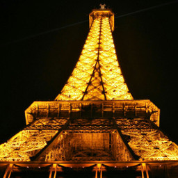 gold eiffel tower night lights